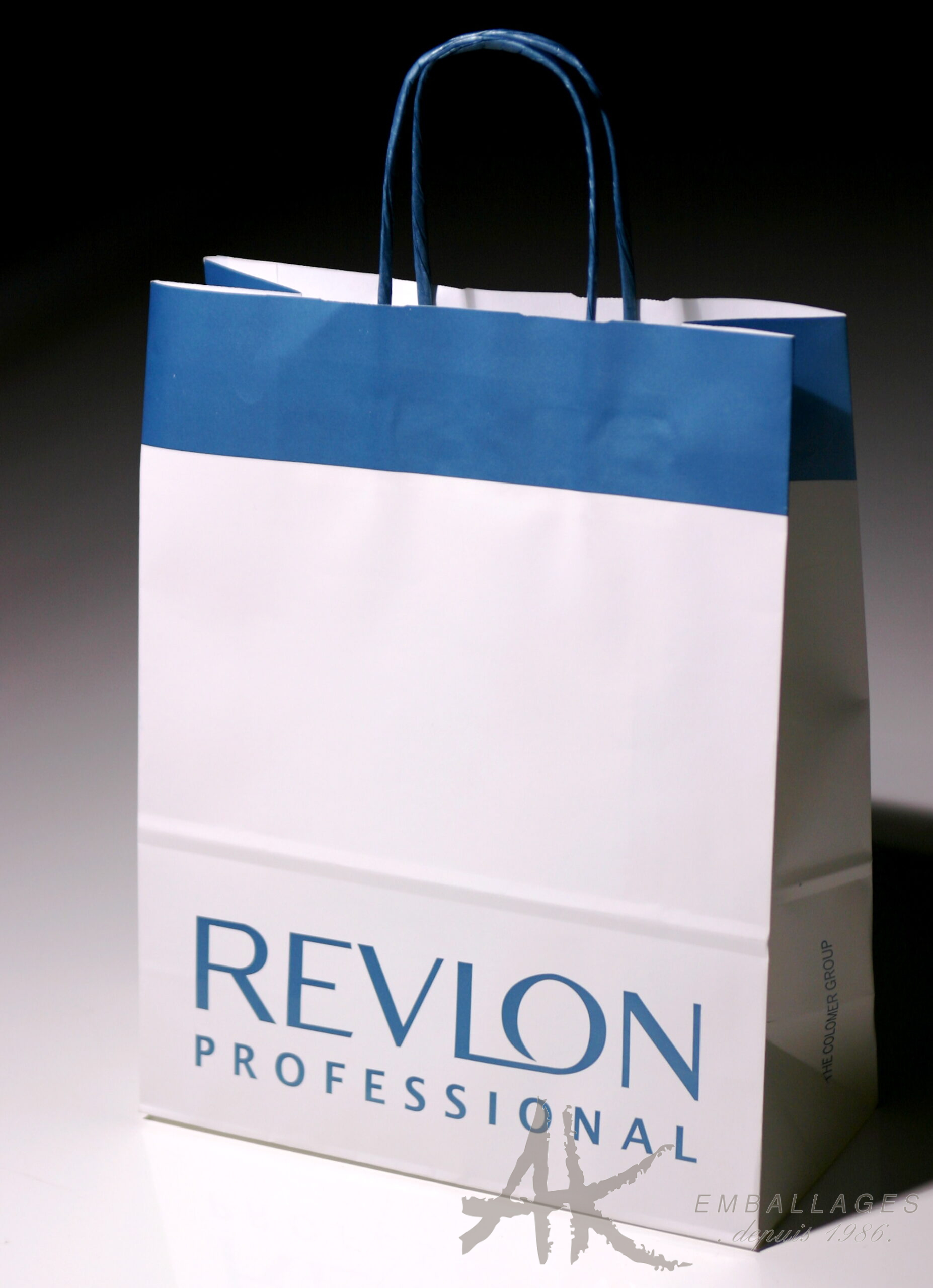 sac papier poignée torsadée - REVLON logo