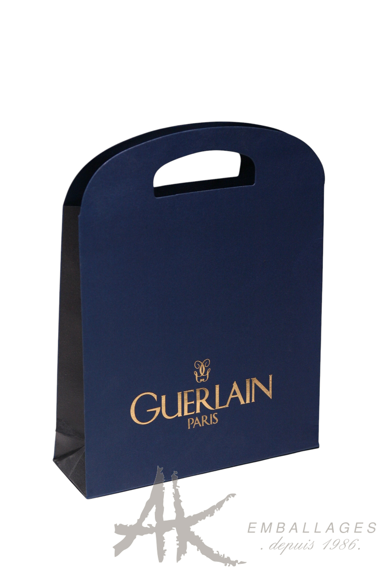sac papier bleu imprimé or GUERLAIN - poignée découopée